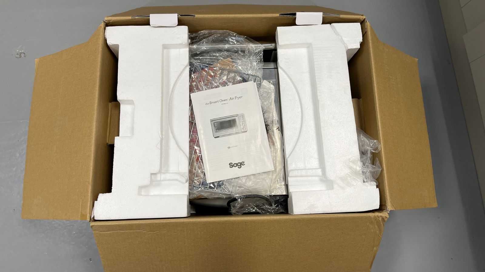 The Breville the Smart Oven Air Fryer Toaster Oven in its cardboard box and packaging
