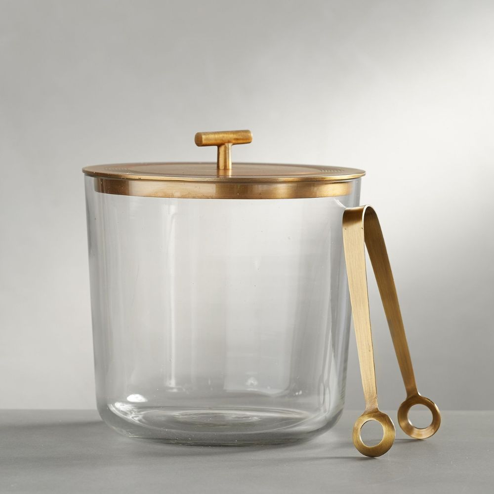 Glass ice bucket with gold lid and tongs