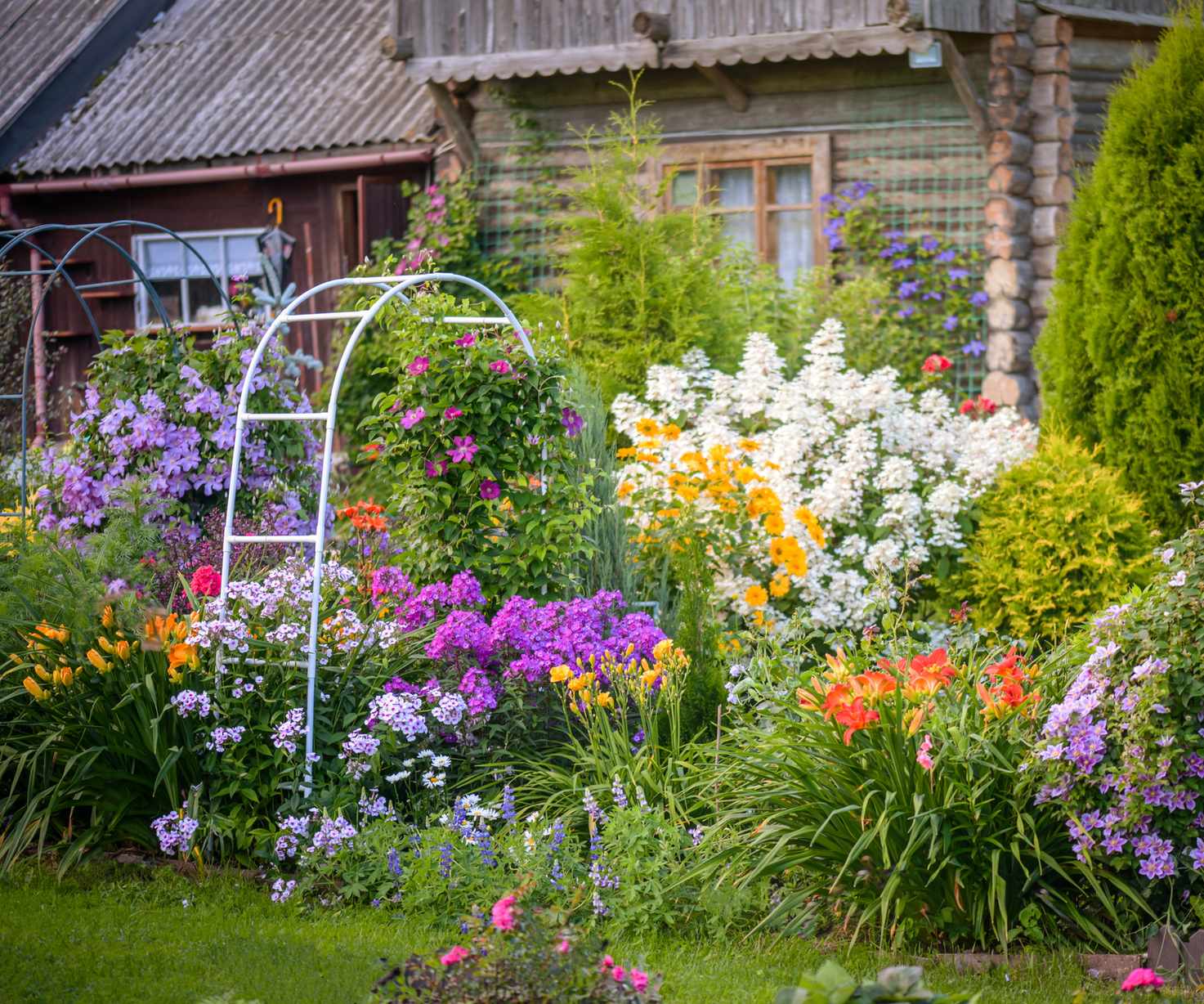 Flower garden border with arbor