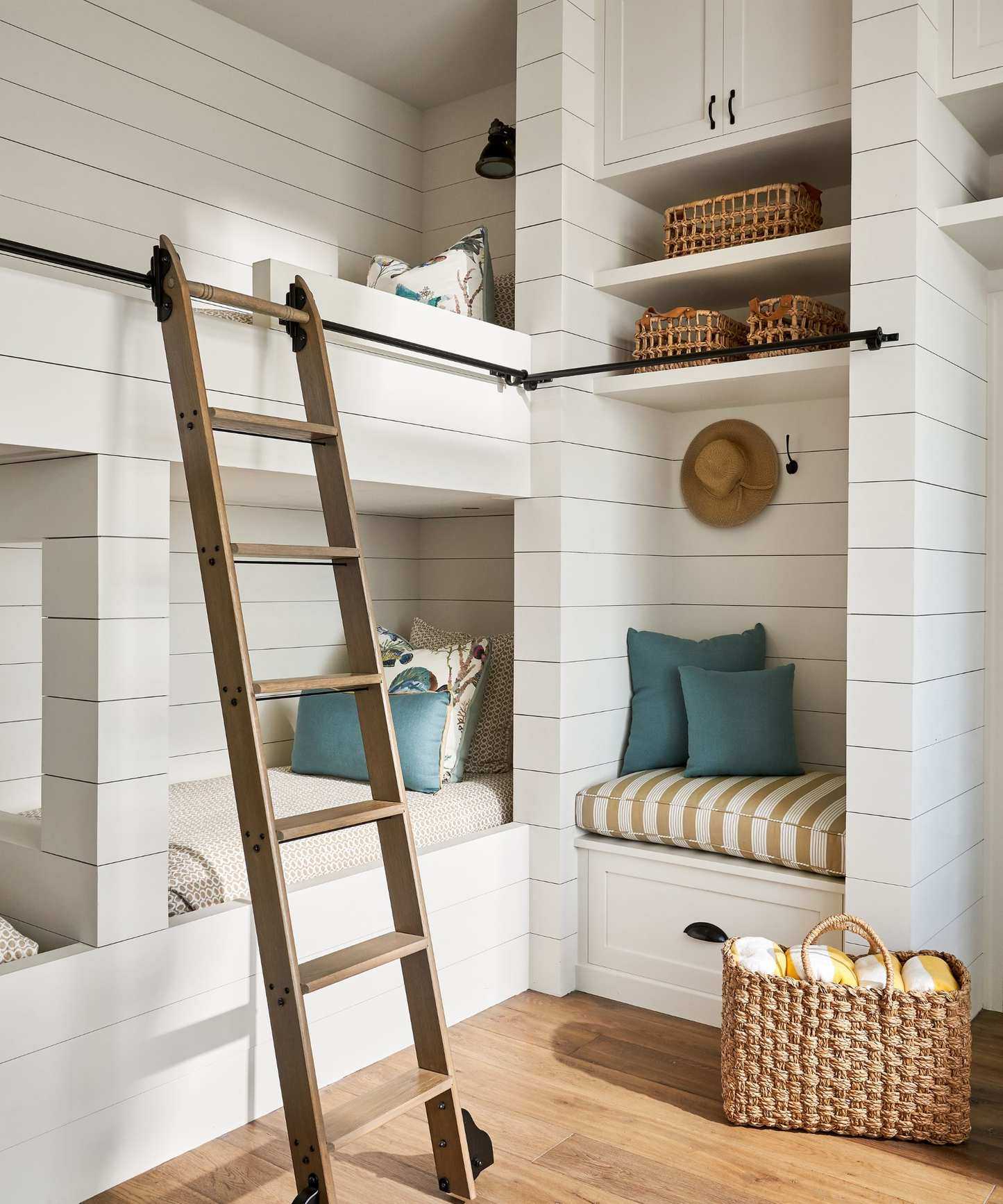 coastal twin bedroom with shiplap and rattan details