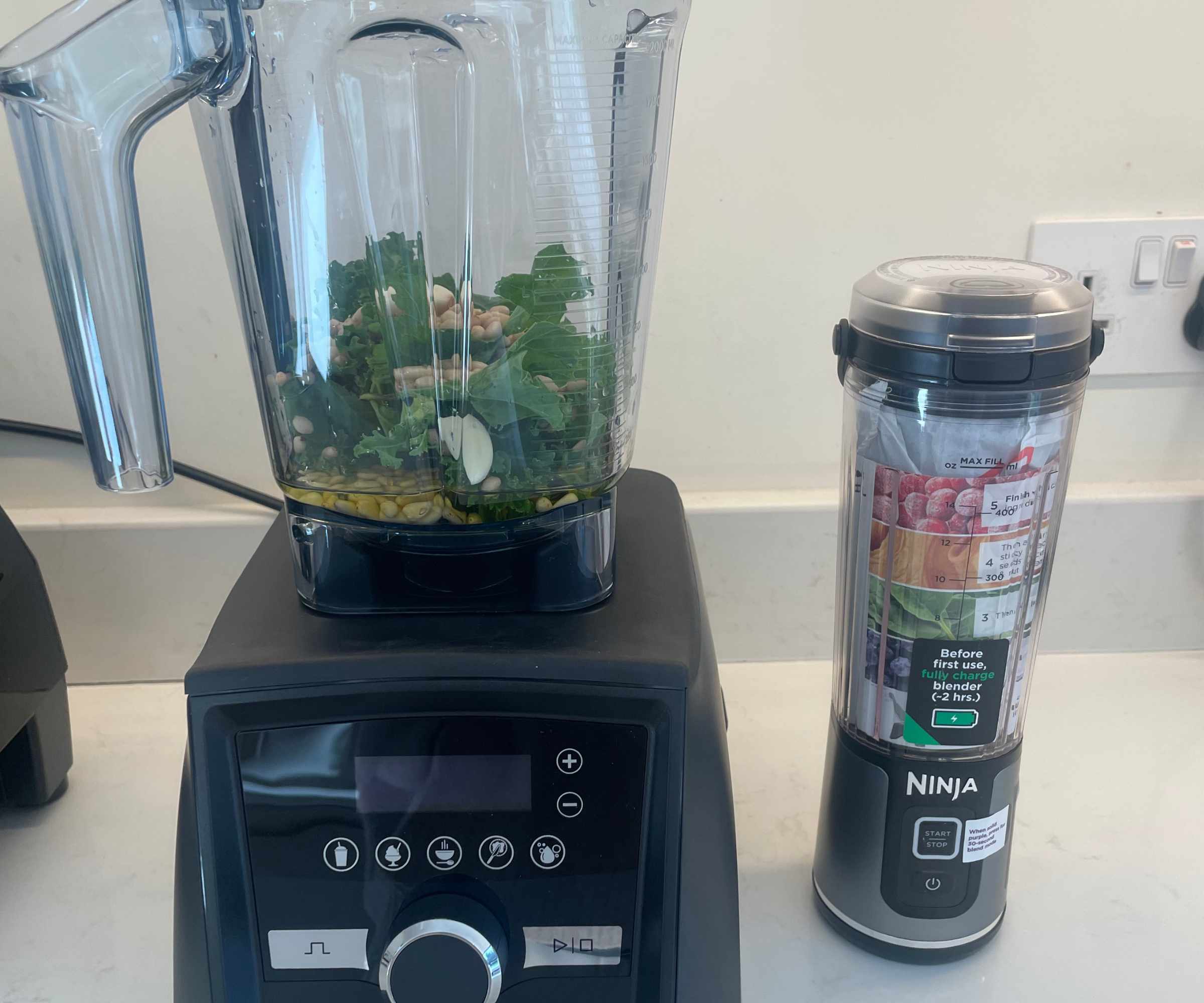 A Vitamix A3500 countertop blender compared to a Ninja Blast Portable Blender