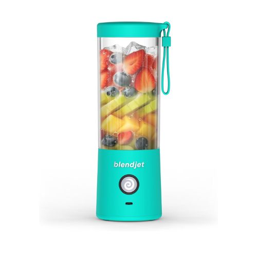 Turquoise blender with fruit inside