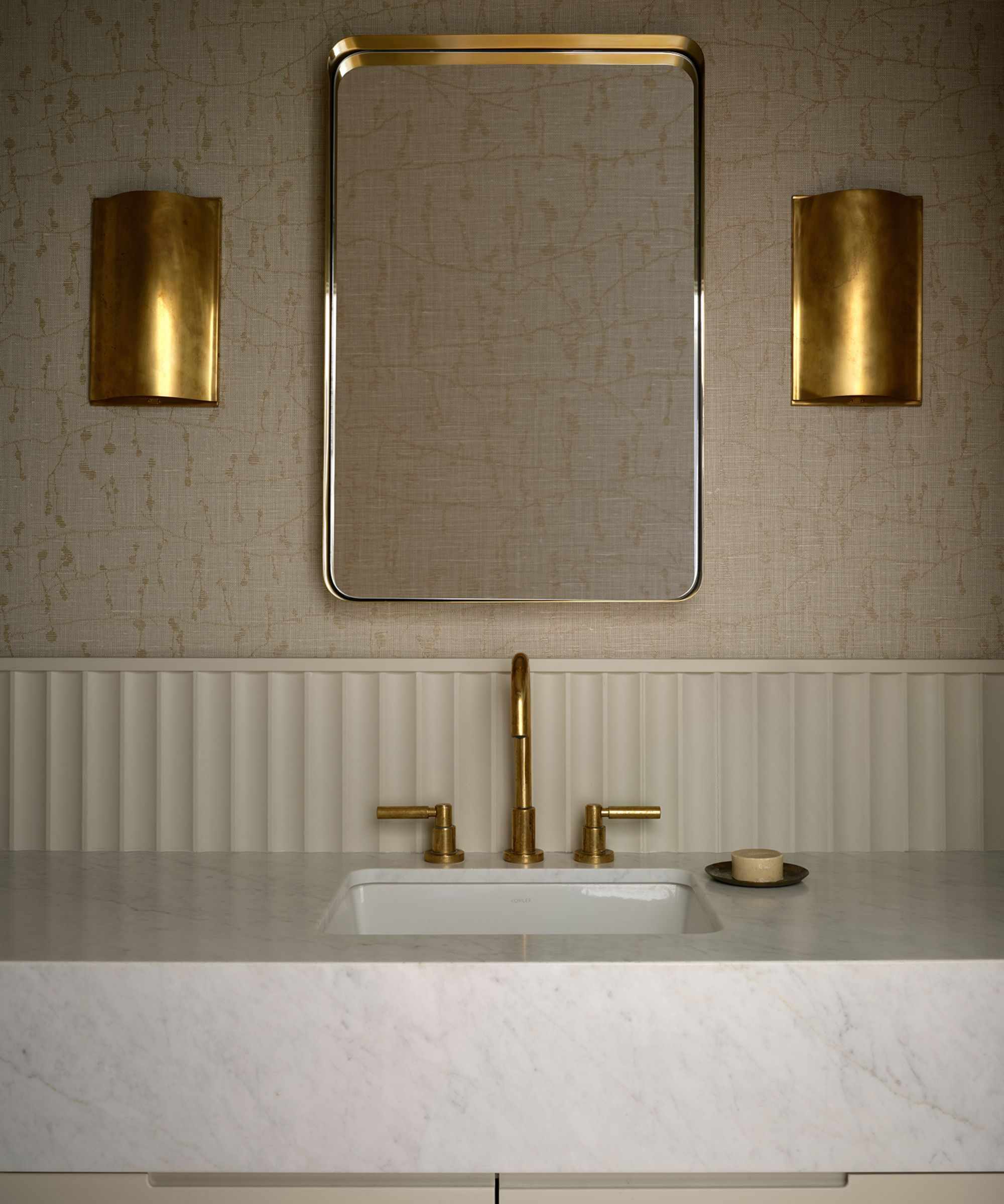 modern bathroom brass wall sconces by emily lauren interiors