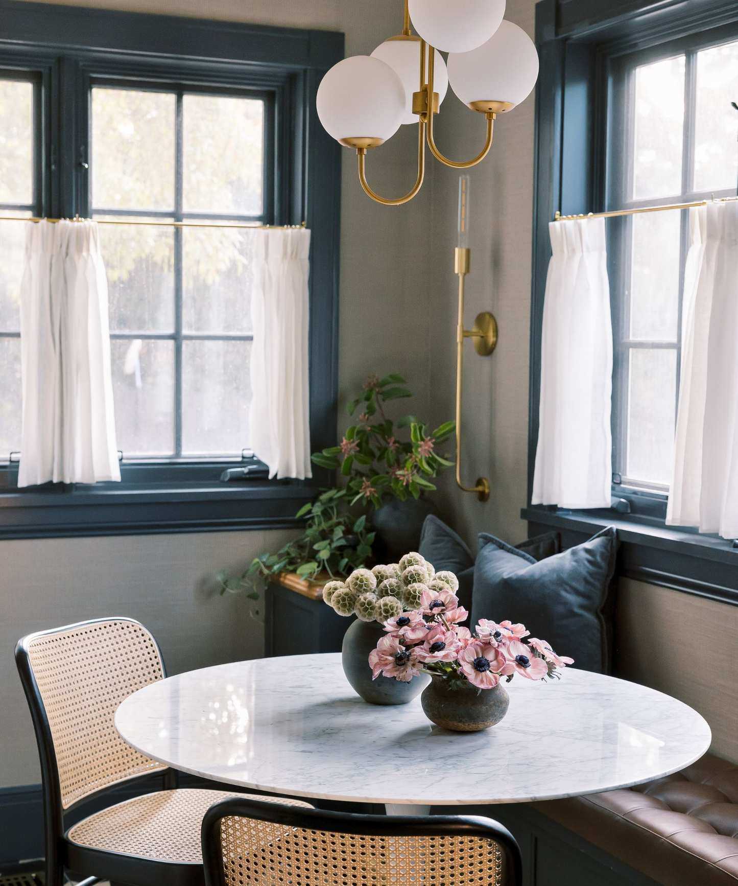 cafe coffee corner in a kitchen with a sheer cafe curtain and small bistro table