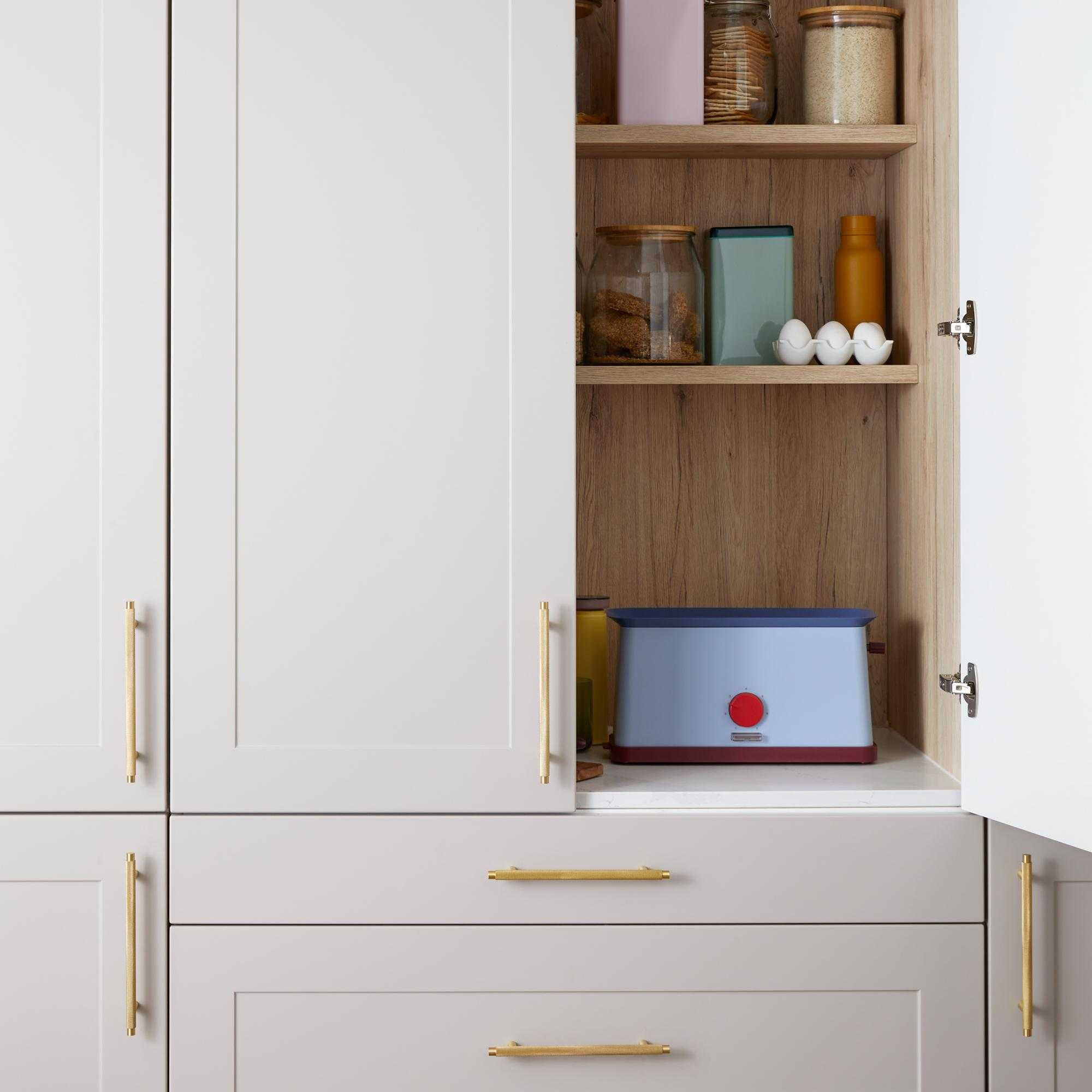 Kitchen cabinet handles by Plank Hardware on neutral cabinets