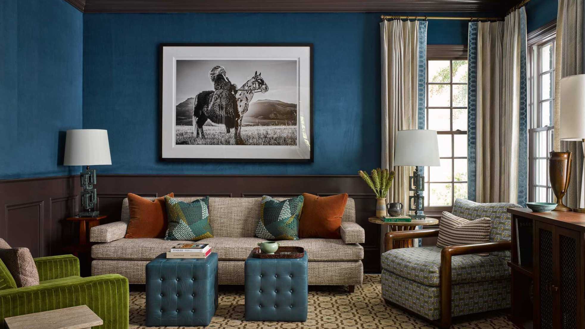 Bold blue living room with brown paneling