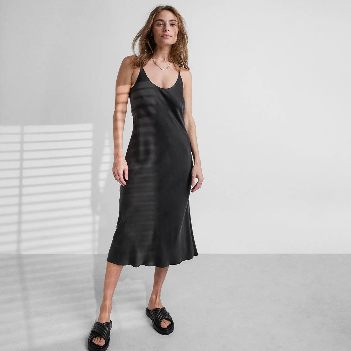 Woman in an elegant sleepwear dress in black