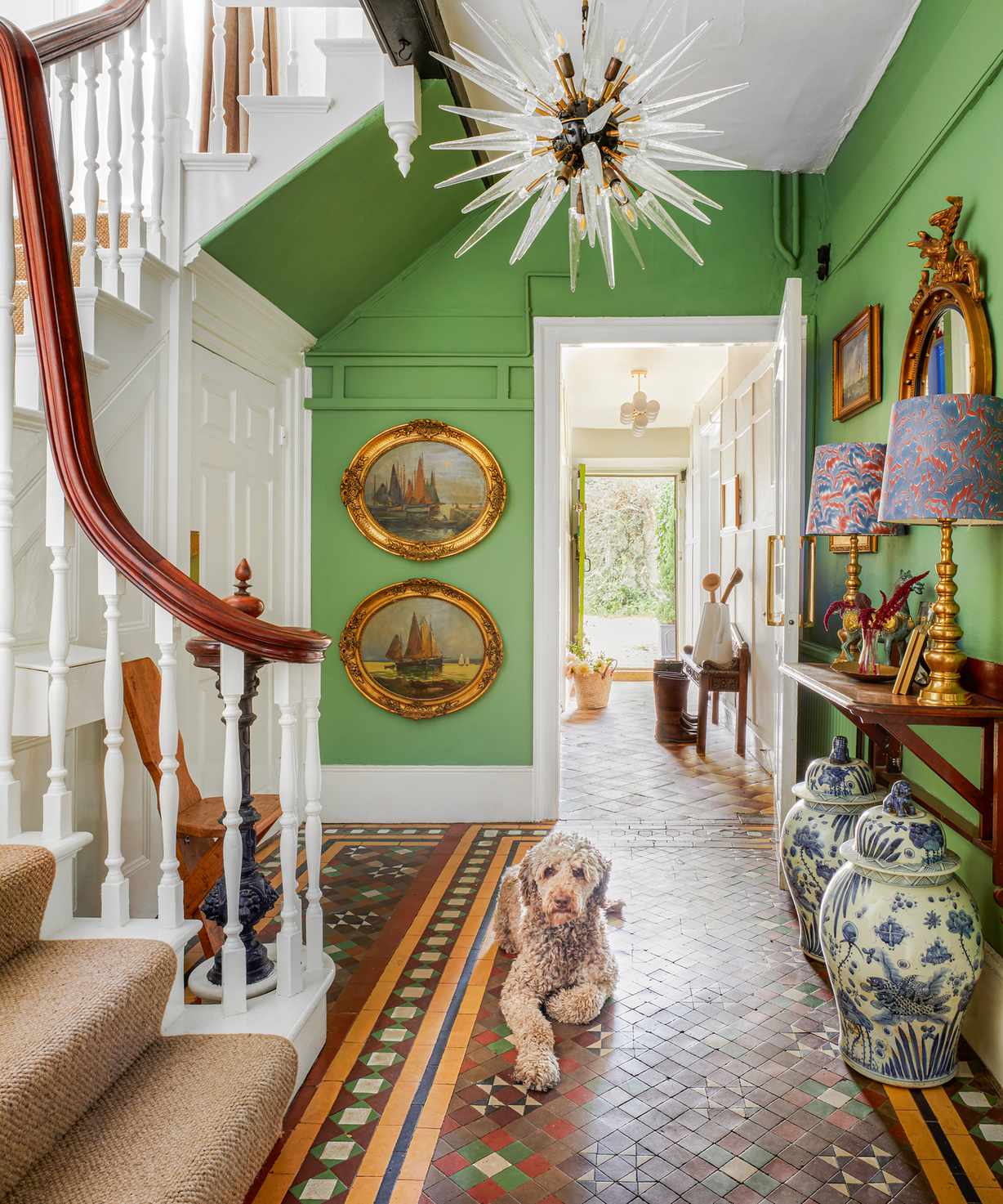 Victorian hallway tiles in brown, yellow, red and green mosaic style, with green walls