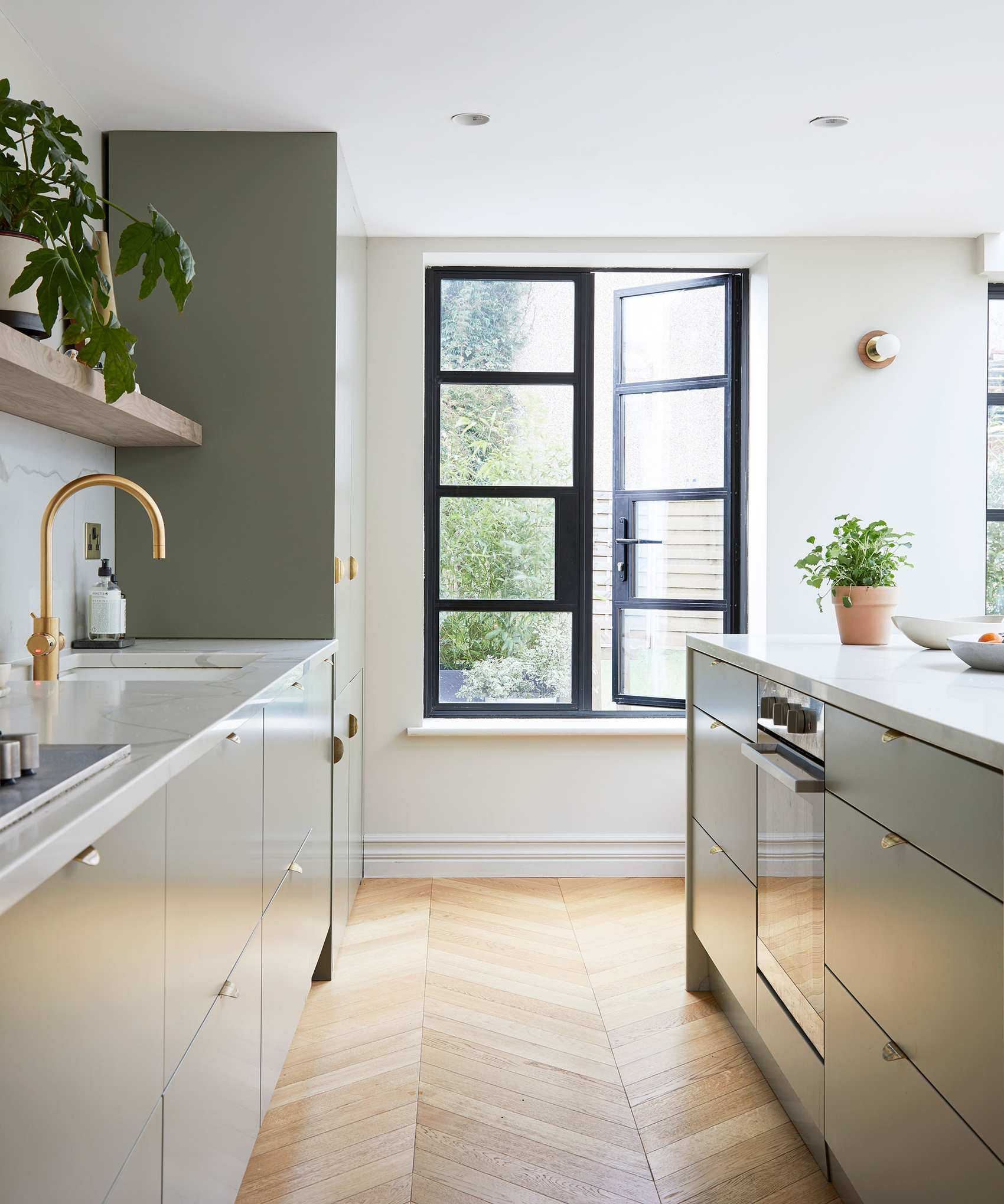Minimalist kitchen ideas with wood floor and crittal doors