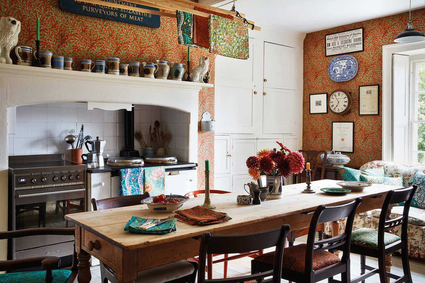 William Morris wallpaper with farmhouse table and white cabinetry