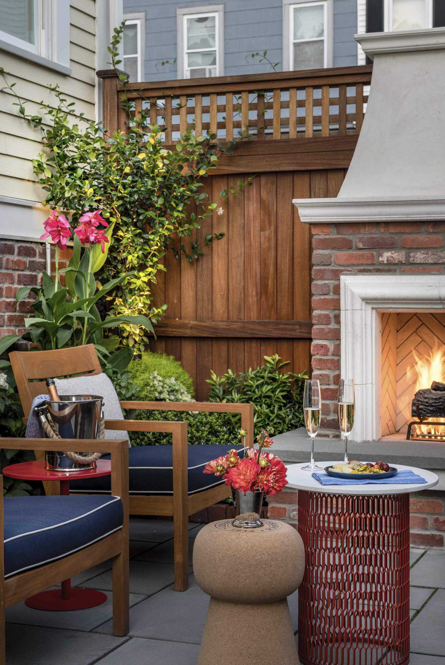 back patio with seating area around fireplace