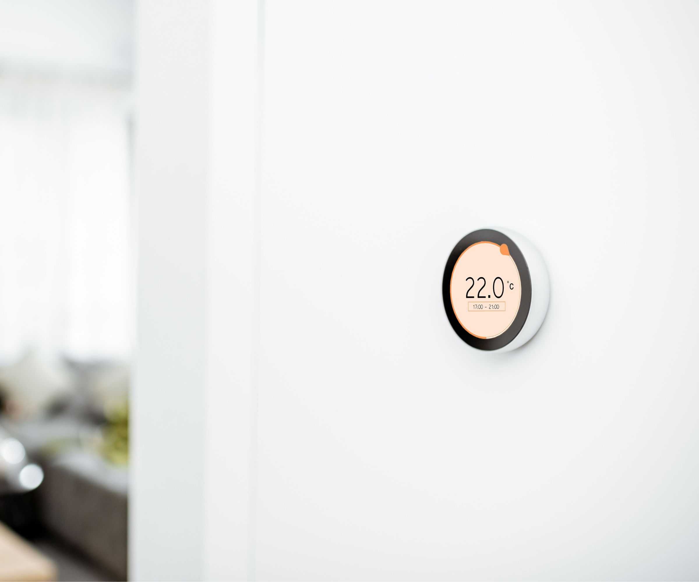 Smart thermostat on a white wall