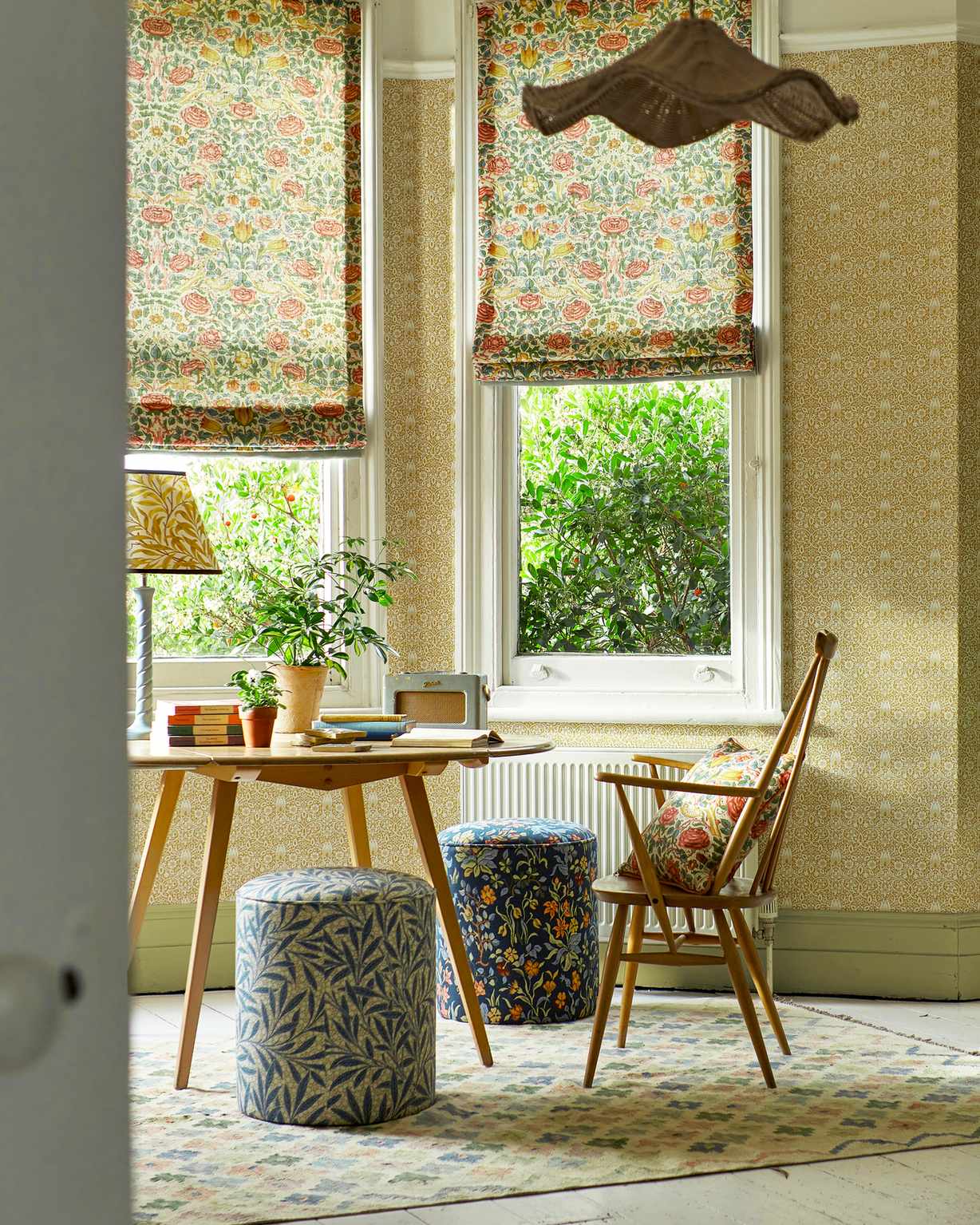 Dining area with Arts &amp; Crafts Morris &amp; Co wallpaper and blinds