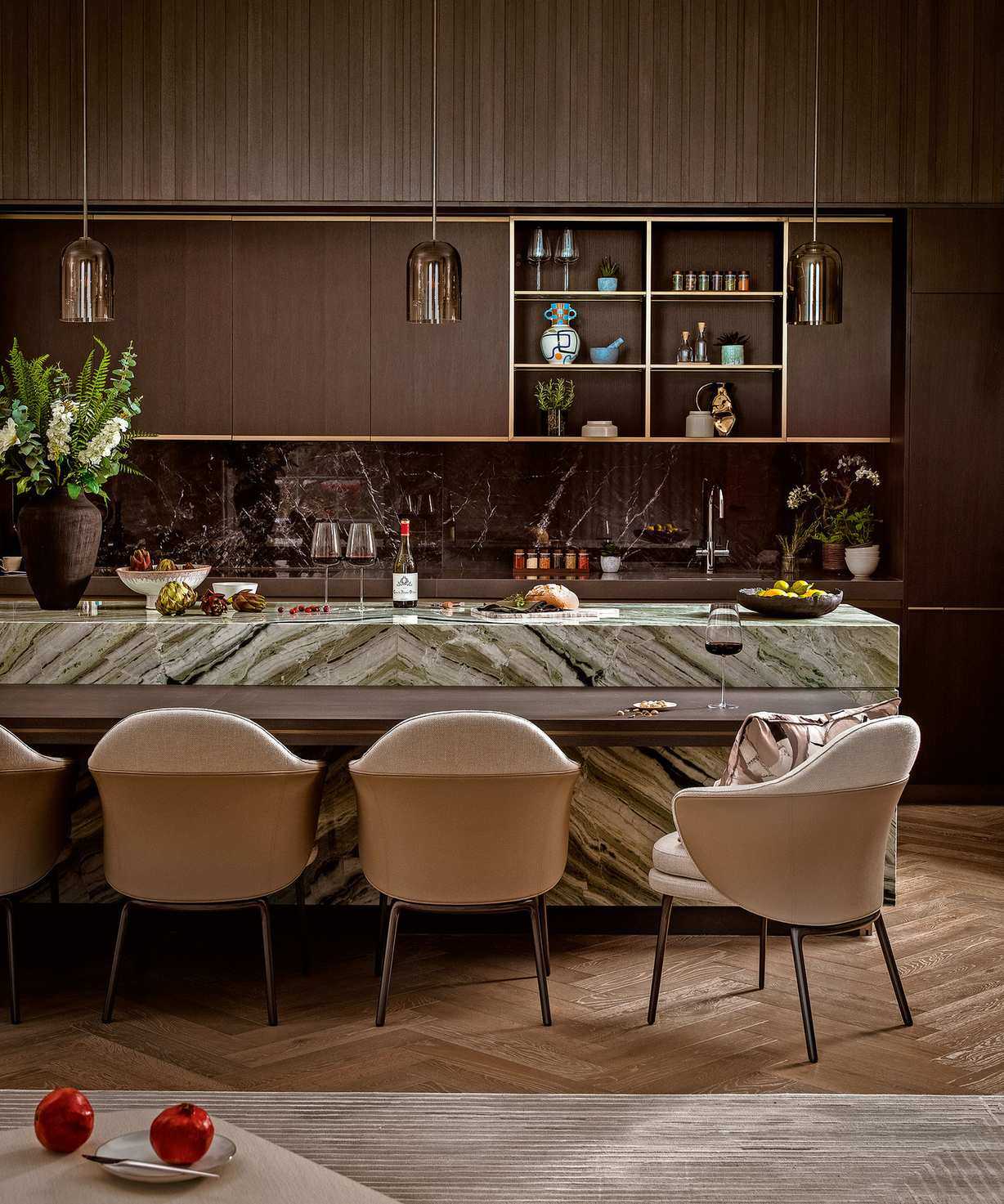 Brown kitchen with wood cabinets and marble surface