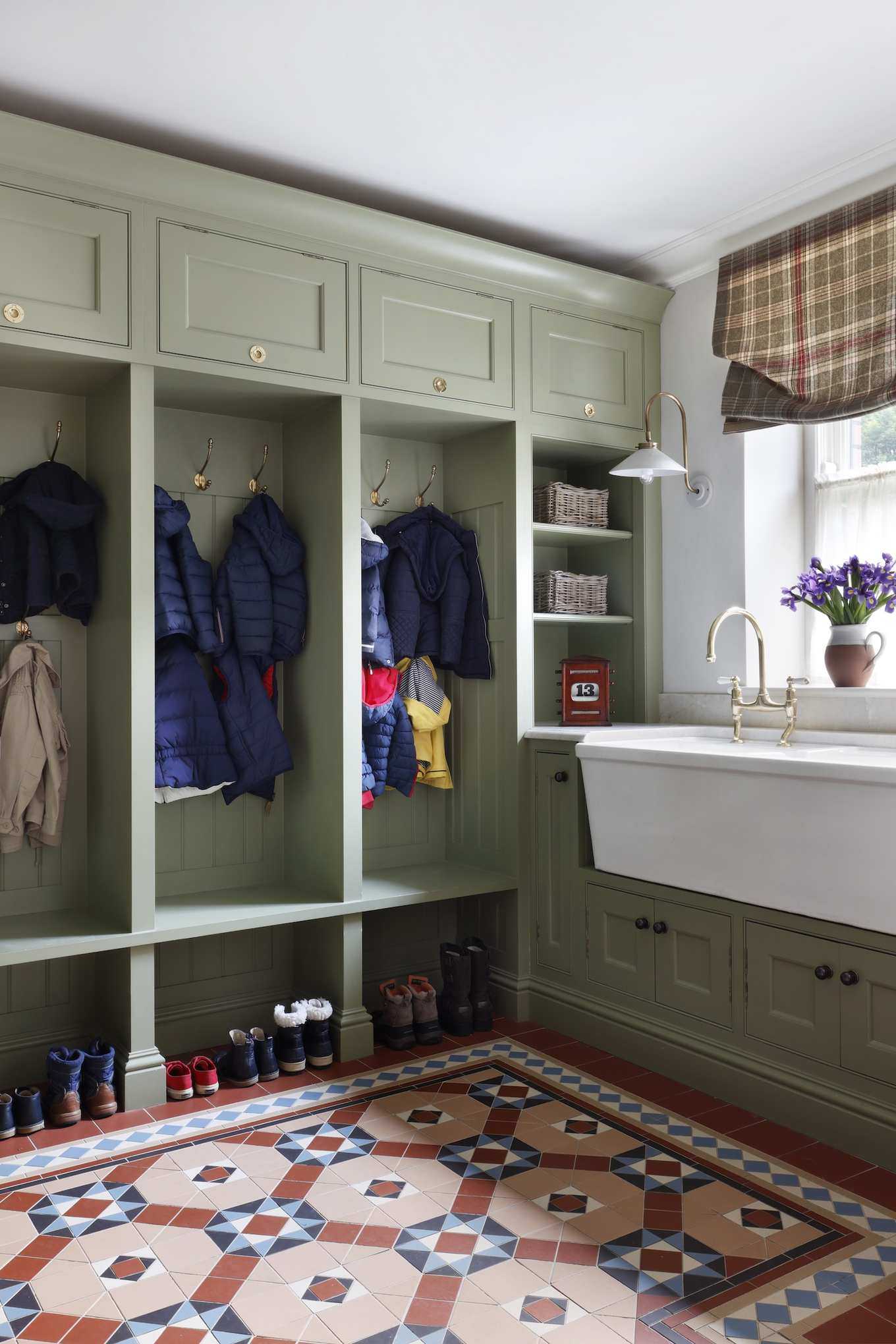 boot room storage with Victorian tile floor and double ceramic sink