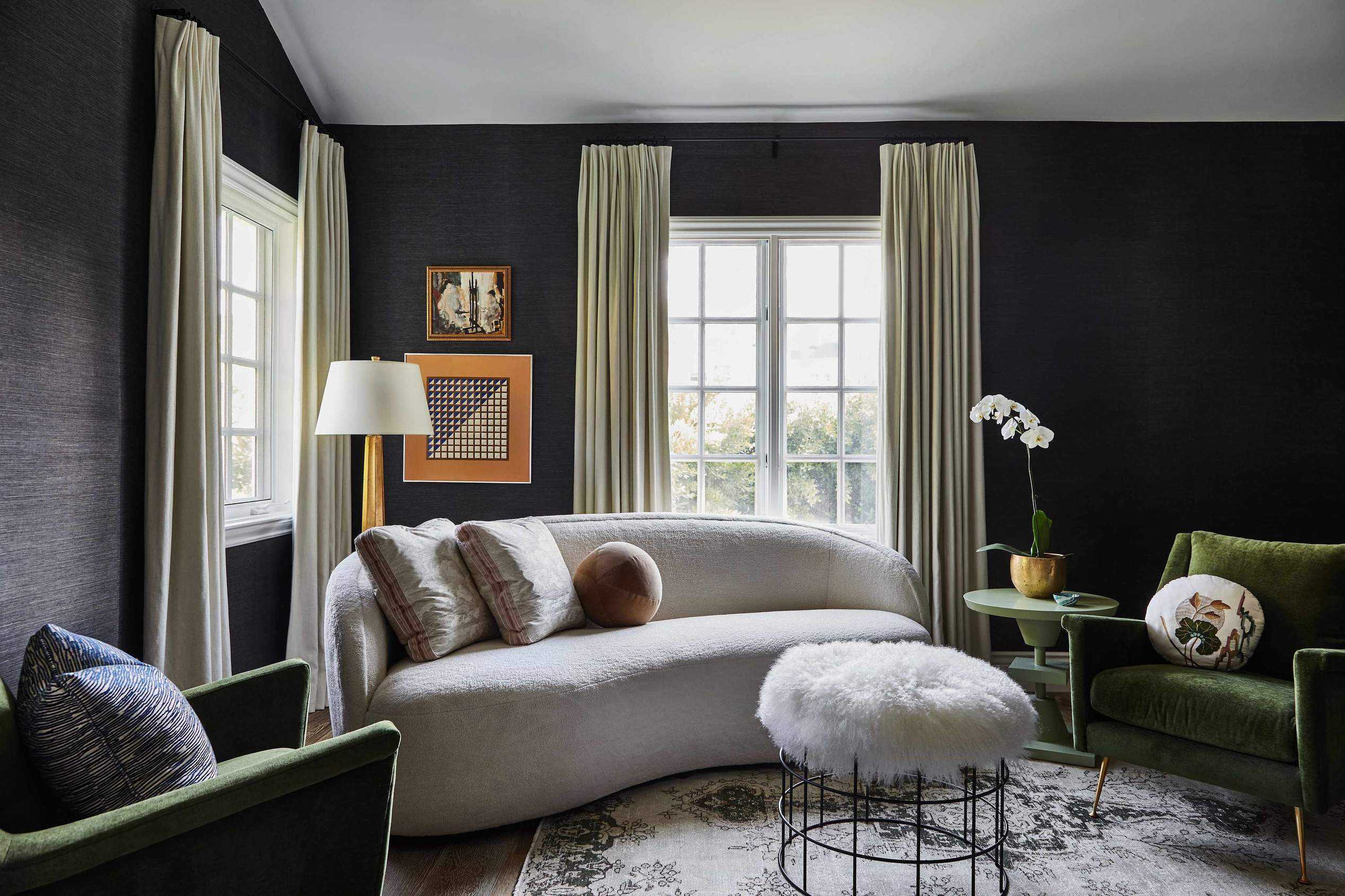 living room with dark walls and modern furniture