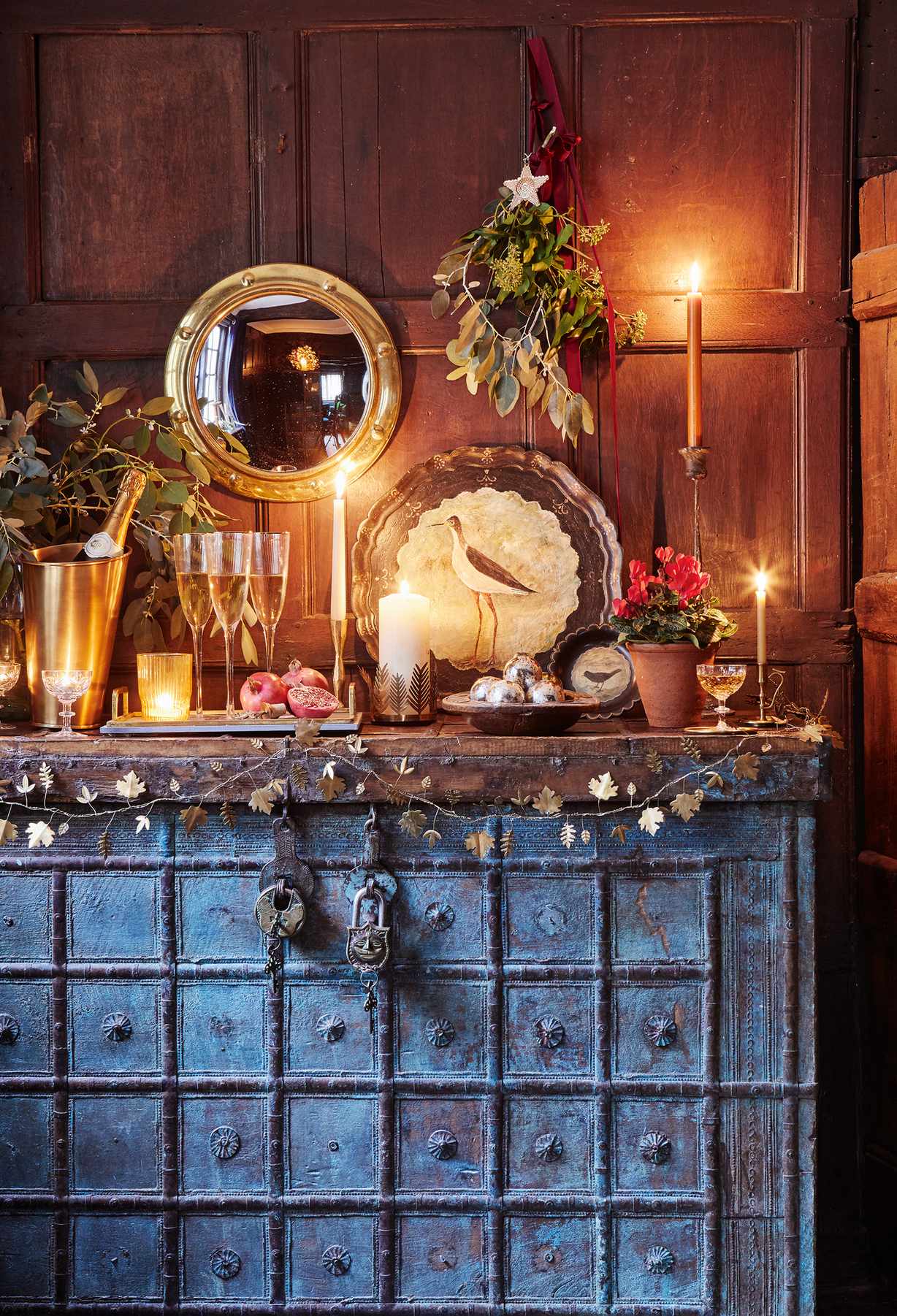 Old indian chest styled for New Year with champagne and flutes