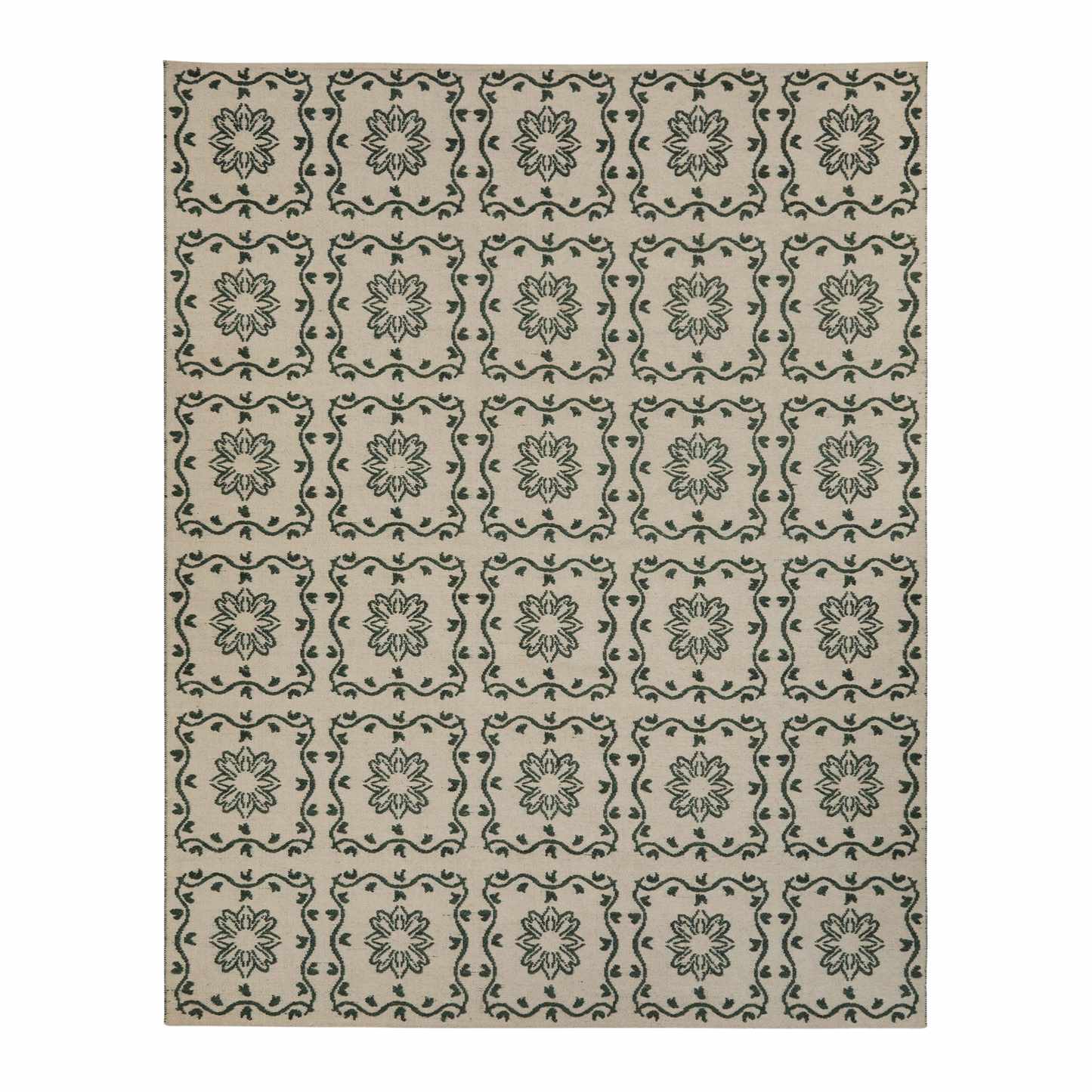 a green patterned outdoor rug