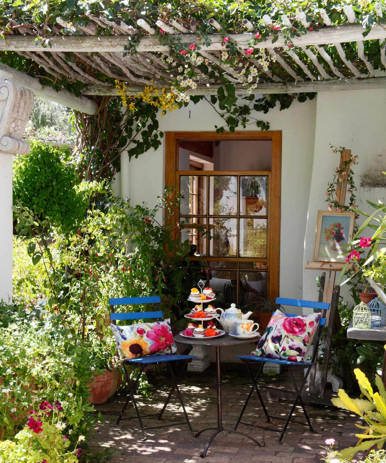 Mediterranean garden patio with pergola and seating area