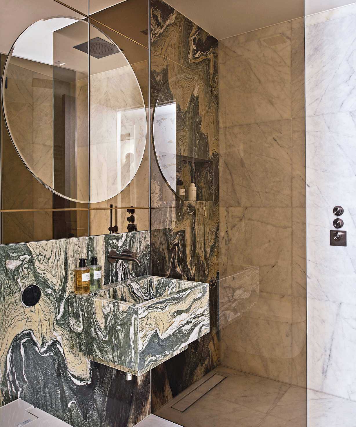 Marble basin and splashback in a bathroom