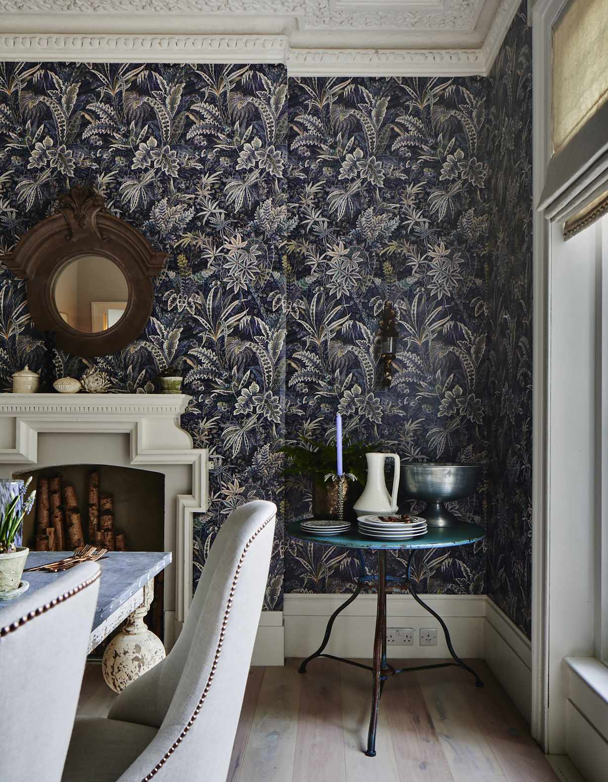 Dark botanical wallpaper in dining room