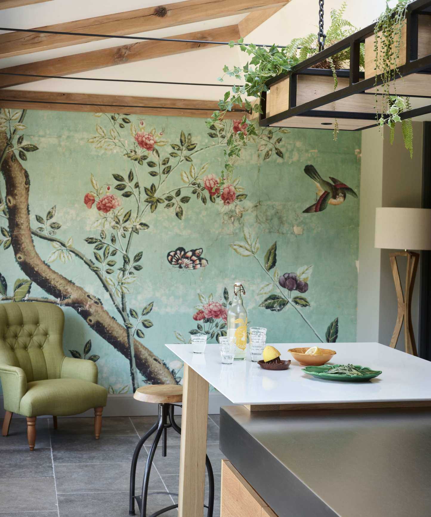 Green kitchen mural behind island