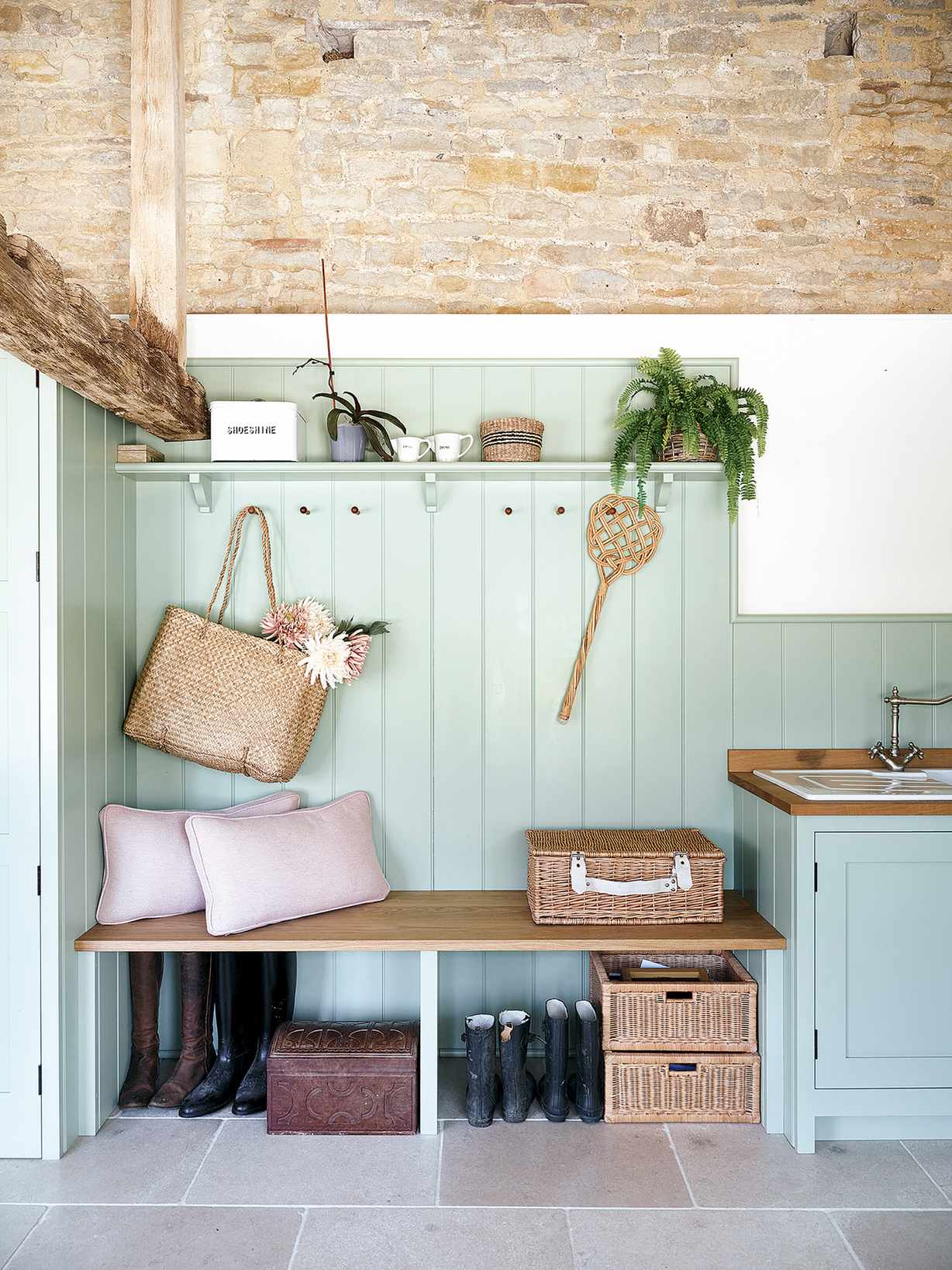 Country bootroom with panelling and fitted seat
