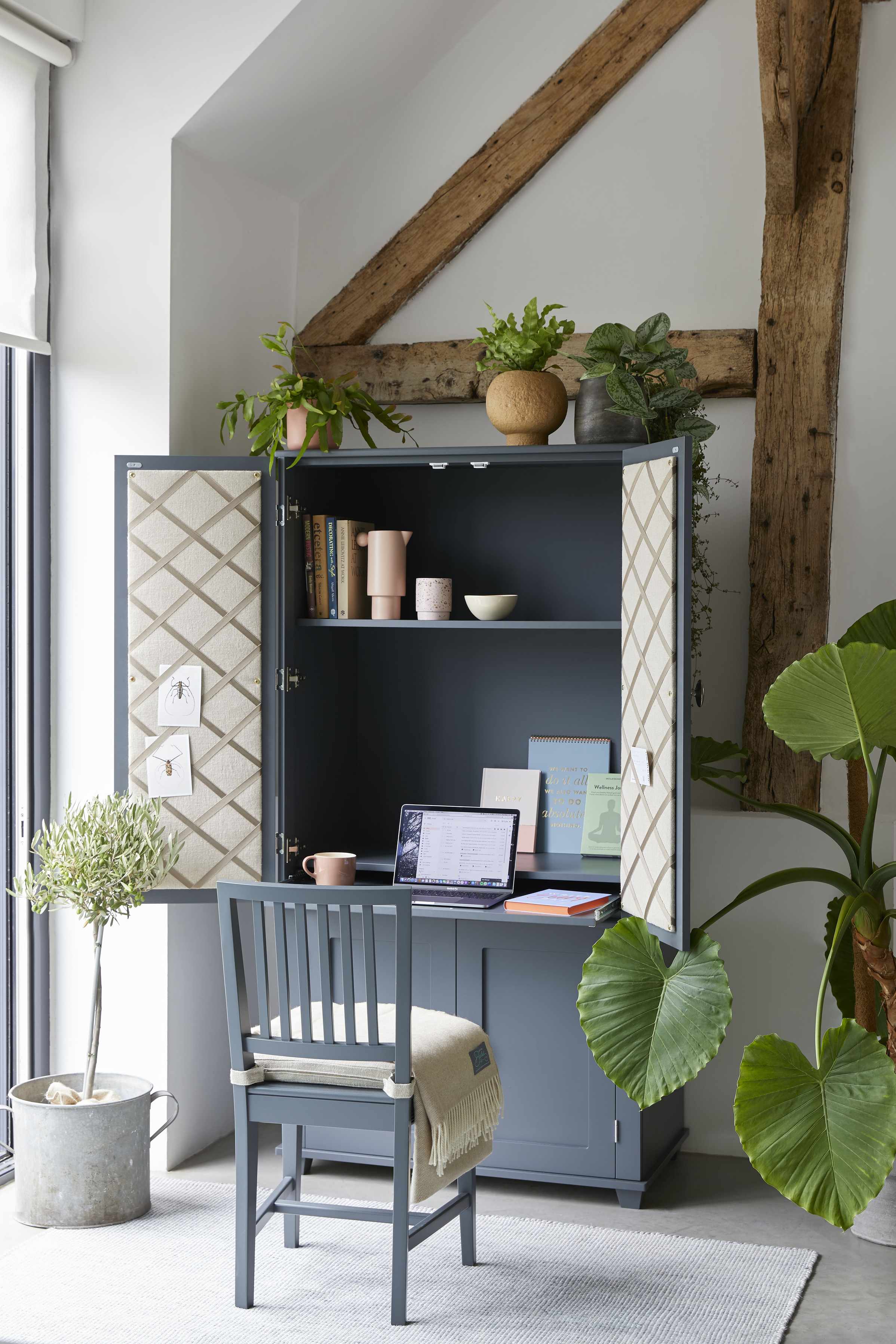 Hidden desks within an armoire