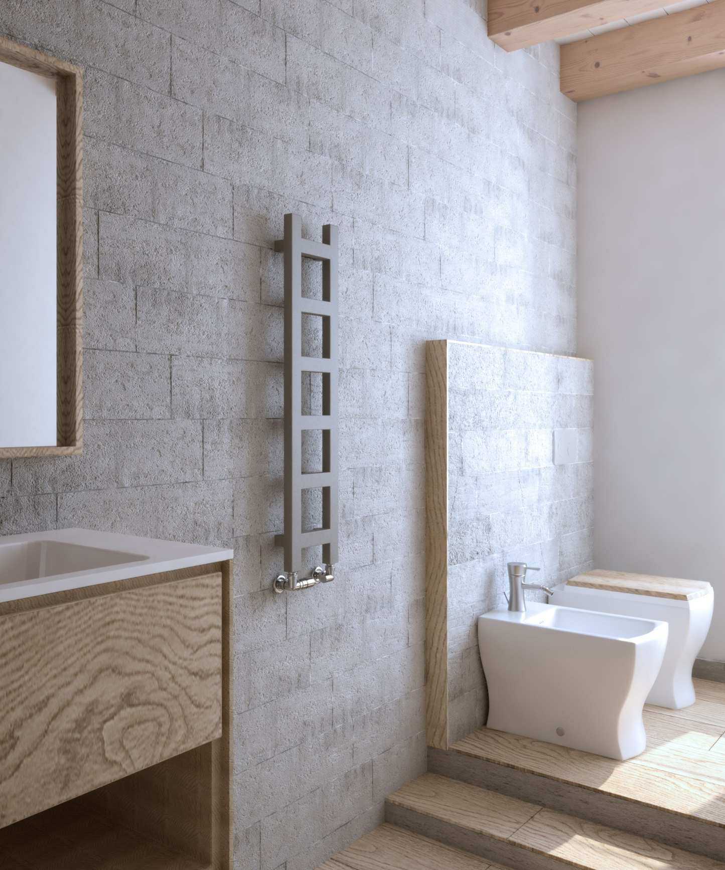 A gray ladder radiator on a stone bathroom wall, beside a wooden basin unit with a square mirror above, and some small steps up to a bidet and toilet.