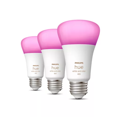 Three pink and white Philips Hue smart bulbs against white background