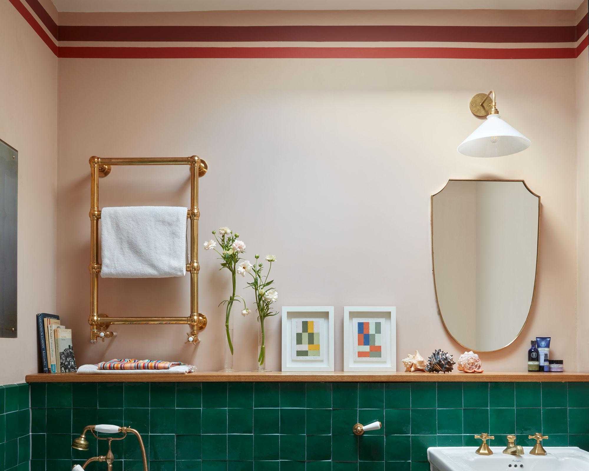 Bathroom with painted stripes on pink wall