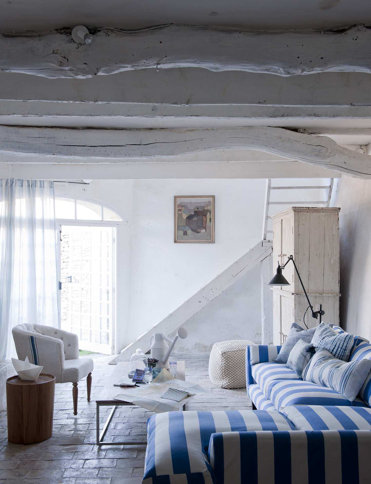 Coastal living room with striped sofa
