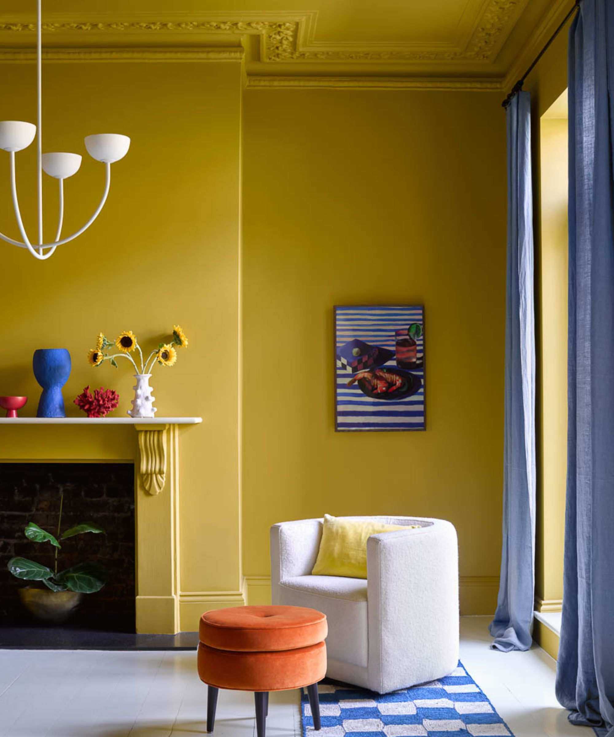 Living room in Smokey Green by Benjamin Moore with coving detail in Outrageous Orange