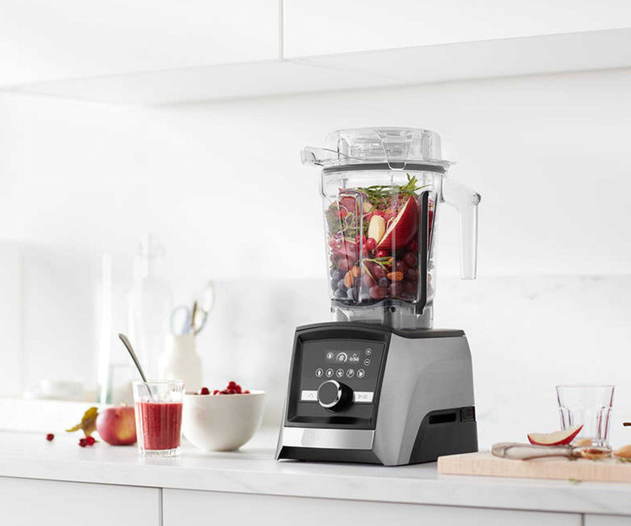 Vitamix A3500 on countertop blending a fruity mix